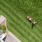 person using STIHL RMA 510 Battery Lawn Mower AP System available at Cannings. A quiet, high-performance battery mower for medium to large lawns and professional outdoor maintenance.
